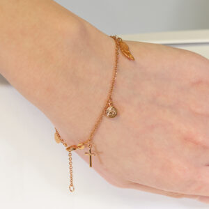 18ct rose gold cross, medallion and feather charm rosary bracelet