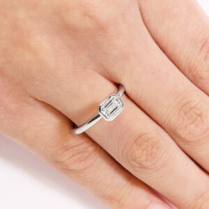 18ct white gold emerald cut bezel set diamond solitaire ring