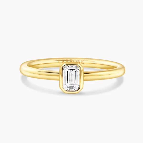 18ct yellow gold 0.30ct FG VS emerald cut diamond bezel set solitaire ring