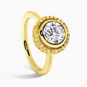 18ct yellow gold round bezel diamond ring with yellow diamond halo