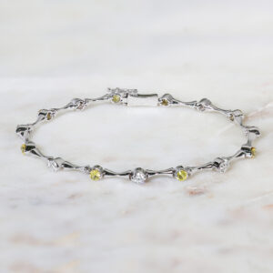 18ct white gold diamond and yellow sapphire bracelet