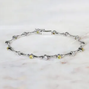 18ct white gold diamond and yellow sapphire bracelet