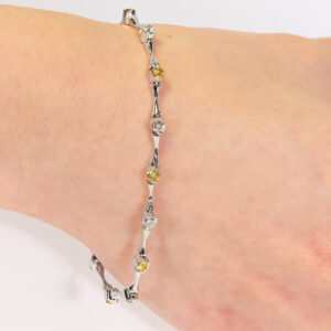 18ct white gold diamond and yellow sapphire bracelet