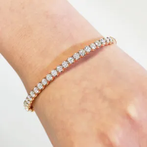 18ct rose gold claw set diamond hinged bangle