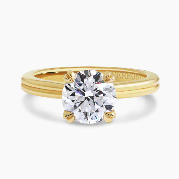 18ct yellow gold round brilliant cut diamond solitaire ring in a four claw setting